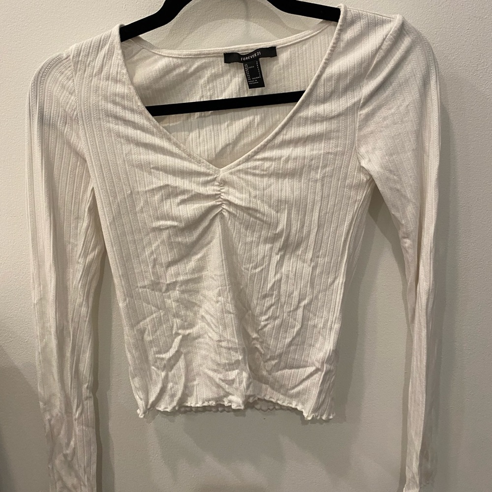 Essential white long sleeve tee for layering, going out, bars, date night